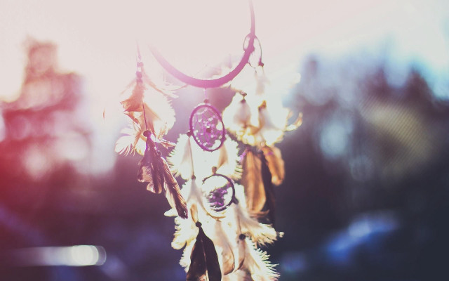 Wind chime feathers sunlight blurry free wallpaper for desktop - medium preview image