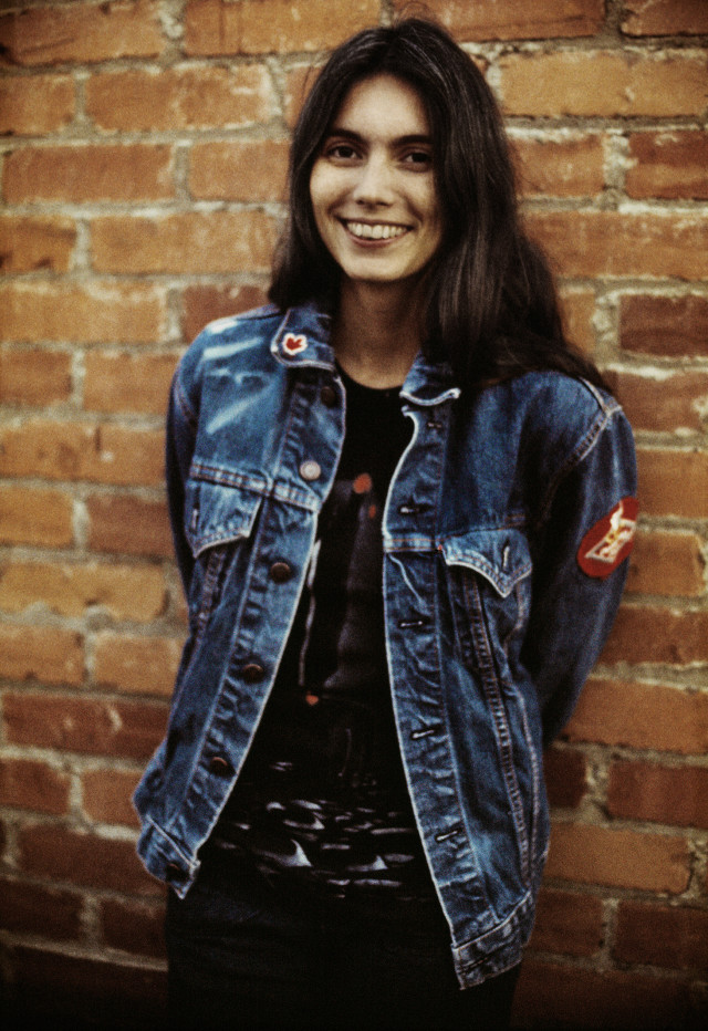 Woman brick wall jean jacket free wallpaper for mobile - medium preview image