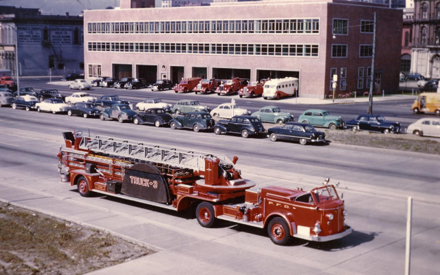 Fire truck parked building background free wallpaper for desktop - medium preview image