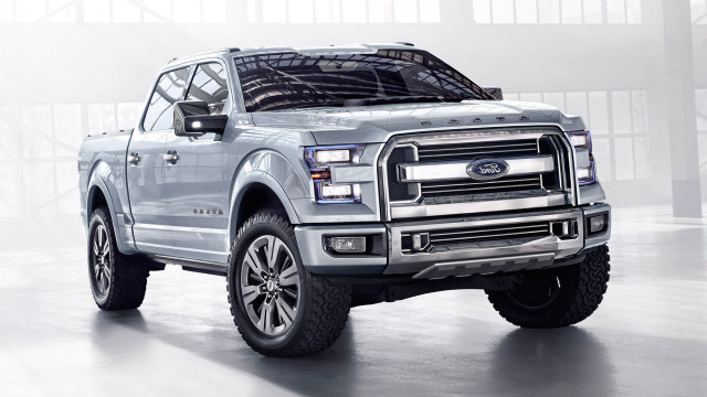 Silver truck parked building large free wallpaper for desktop - medium preview image