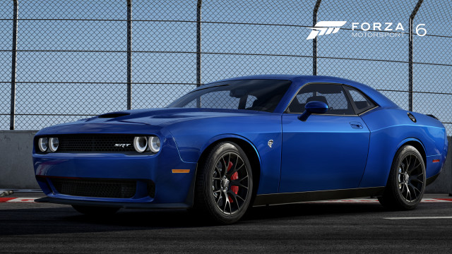 Blue sports car parked fenced free wallpaper for desktop - medium preview image