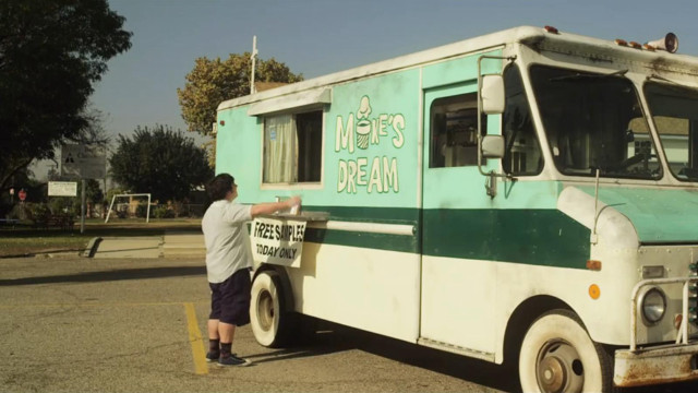 Man standing food truck sign free wallpaper for desktop - medium preview image