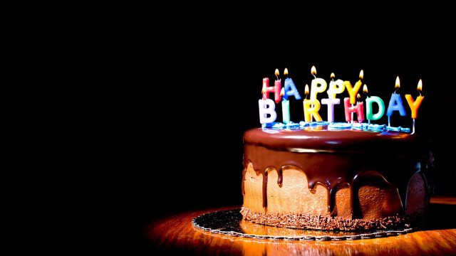Chocolate birthday cake lit candles #2 free wallpaper for desktop - medium preview image