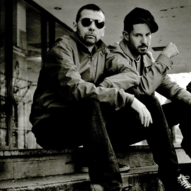 Two men sitting ledge sunglasses free wallpaper for tablet - medium preview image