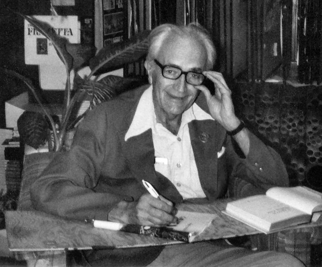 Man sitting desk book pen #2 free wallpaper for desktop - medium preview image