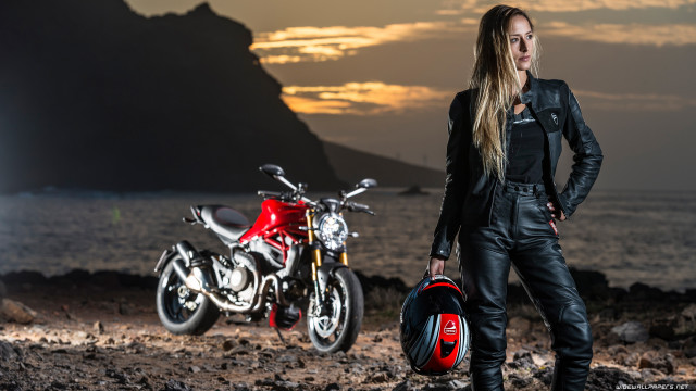 Woman motorcycles rocky beach sunset free wallpaper for desktop - medium preview image