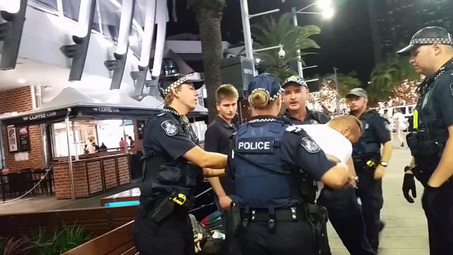 Police officers nighttime sidewalk palm free wallpaper for desktop - medium preview image