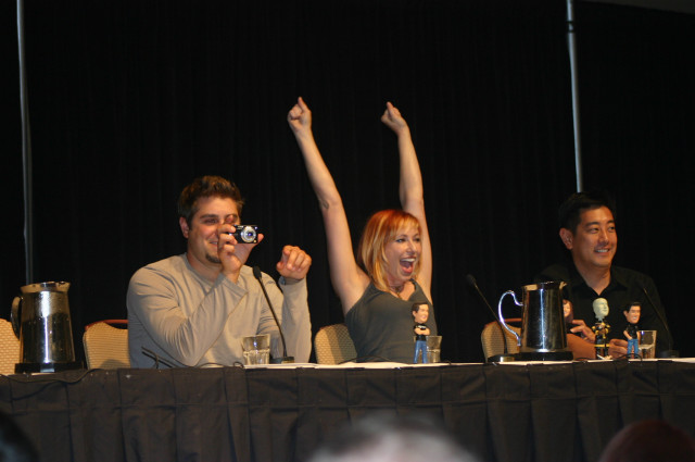 Group hands up table camera free wallpaper for desktop - medium preview image