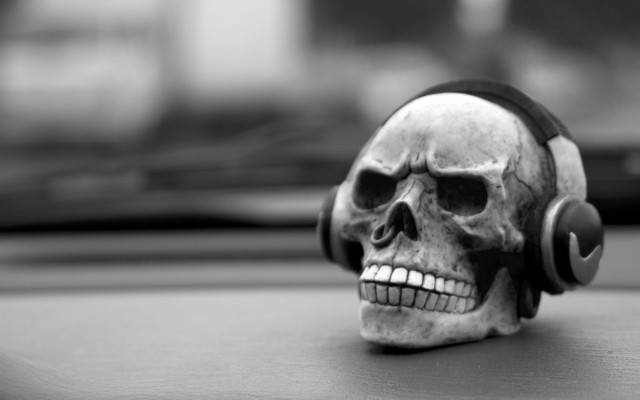 Skull headphones table window blurry free wallpaper for desktop - medium preview image