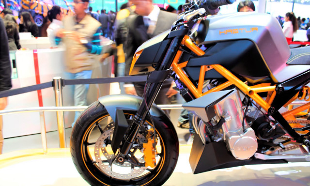 Motorcycle showroom display crowd people free wallpaper for desktop - medium preview image