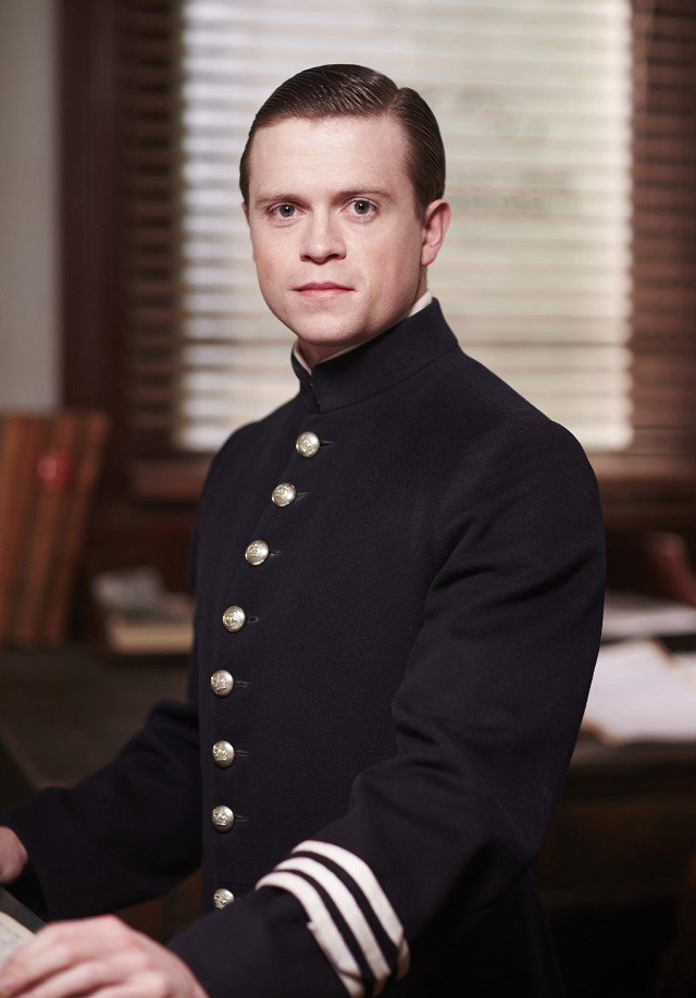 Man uniform sitting desk keyboard free wallpaper for mobile - medium preview image