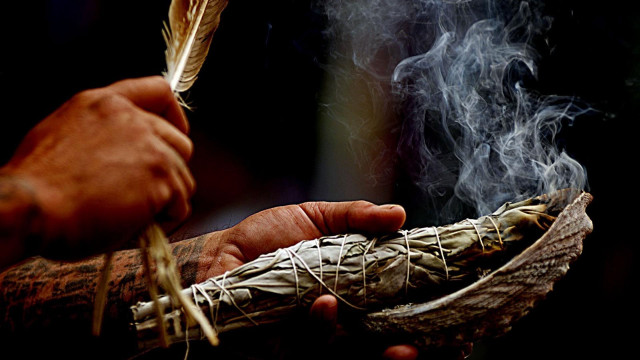 Person holding feather pipe smoke free wallpaper for desktop - medium preview image