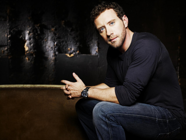 Man brown couch serious expression free wallpaper for desktop - medium preview image