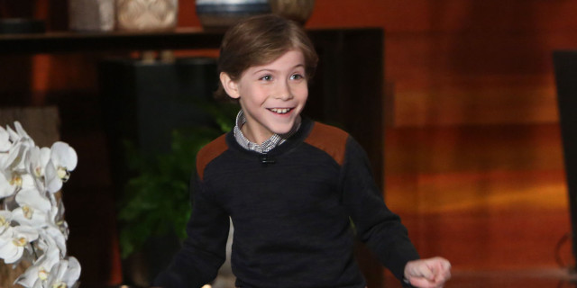 Young boy smiling flower arrangement free wallpaper for desktop - medium preview image