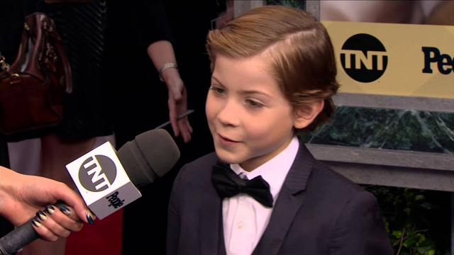 Young boy tuxedo interview reporter free wallpaper for desktop - medium preview image