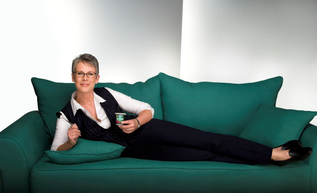 Woman sitting green couch drink free wallpaper for desktop - medium preview image