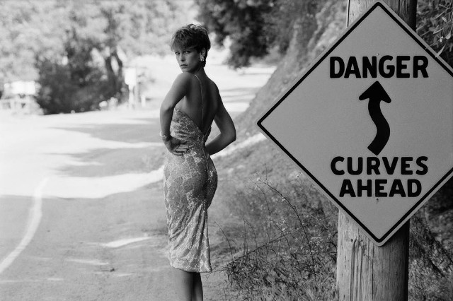 Woman danger curves ahead road free wallpaper for desktop - medium preview image