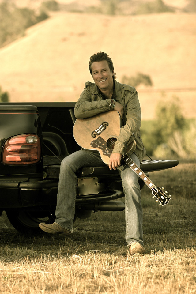 Man truck guitar smiling camera free wallpaper for mobile - medium preview image