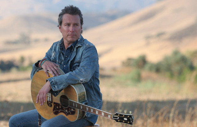 Man sitting rock guitar mountain free wallpaper for desktop - medium preview image