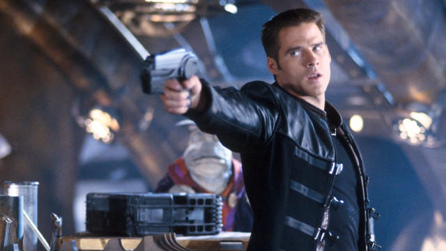 Man holding gun room background free wallpaper for desktop - medium preview image