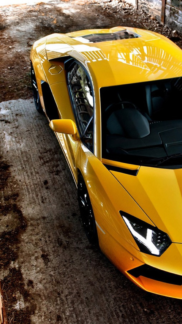 Yellow sports car dirt road #3 free wallpaper for mobile - medium preview image