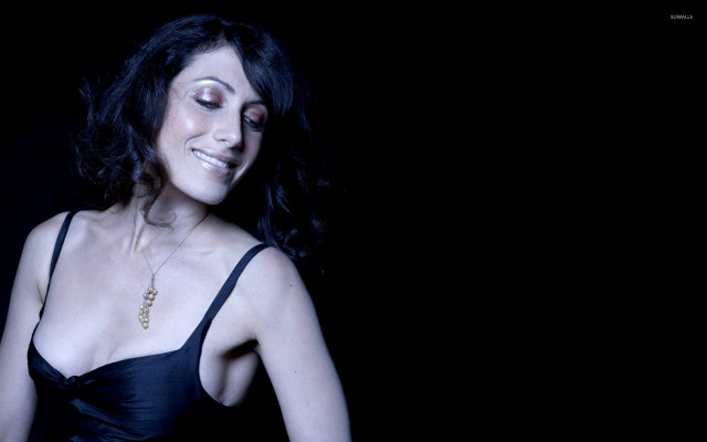 Woman black dress smiling eyes free wallpaper for desktop - medium preview image