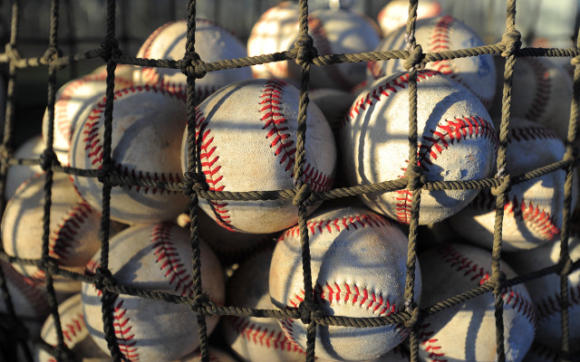 Baseballs in net pile on free wallpaper for desktop - medium preview image