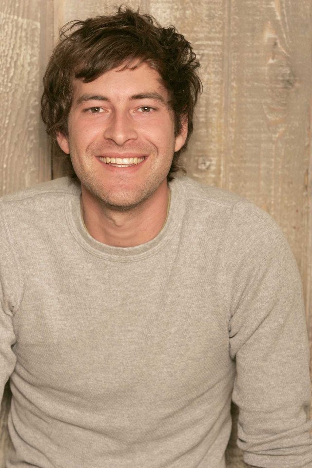 Smiling man wooden wall cell free wallpaper for mobile - medium preview image