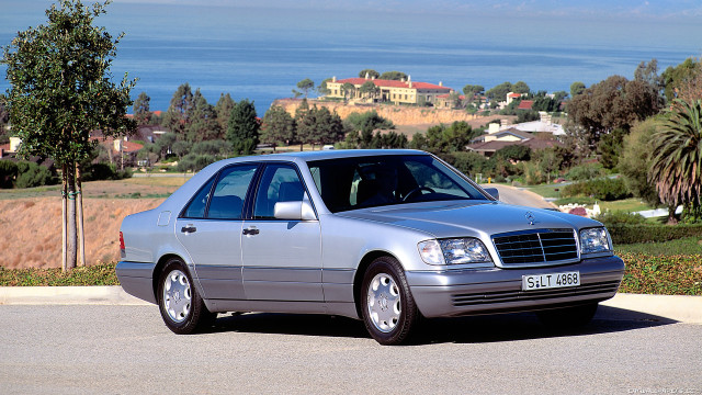 Silver car road hill ocean free wallpaper for desktop - medium preview image