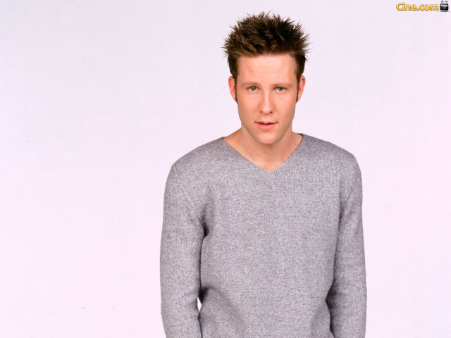 Man mohawk gray sweater jeans free wallpaper for desktop - medium preview image