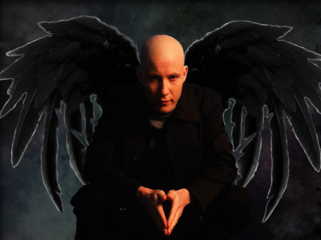 Bald man black wings sitting free wallpaper for desktop - medium preview image