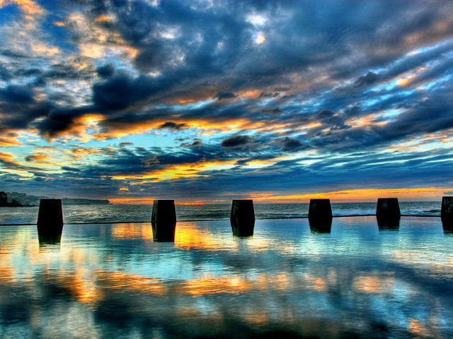 Poles beach cloudy sunset sky free wallpaper for desktop - medium preview image
