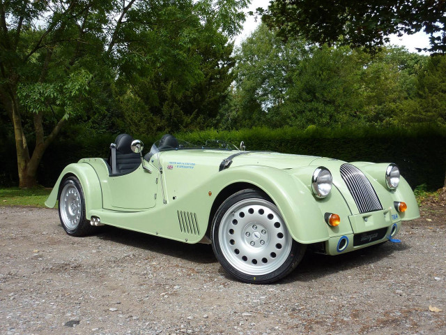 Green car forest trees puzzle free wallpaper for desktop - medium preview image