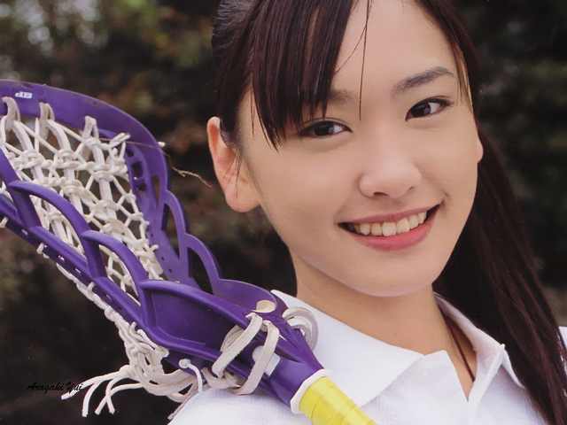 Woman holding purple lacrosse helmet free wallpaper for desktop - medium preview image