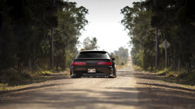 Car parked dirt road forest free wallpaper for desktop - medium preview image