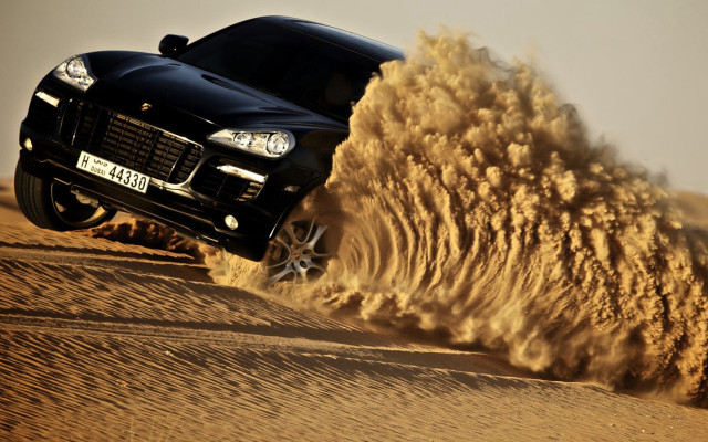 Black car desert sand explosion free wallpaper for desktop - medium preview image