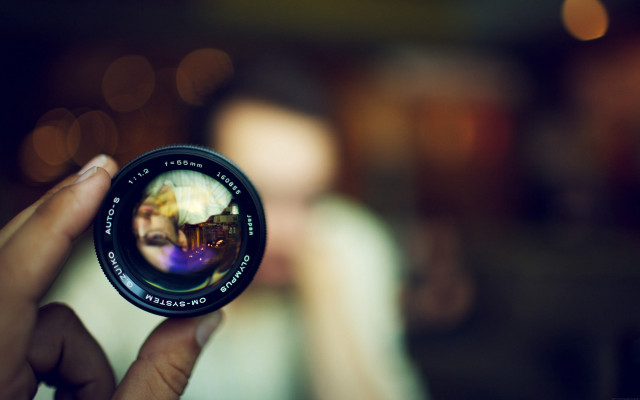 Person holding camera lens blurry #3 free wallpaper for desktop - medium preview image