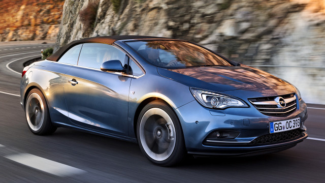 Blue opel car driving cliff free wallpaper for desktop - medium preview image