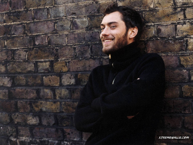 Man leaning brick wall arms free wallpaper for desktop - medium preview image