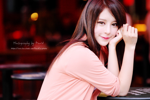 Woman sitting table hand face free wallpaper for desktop - medium preview image