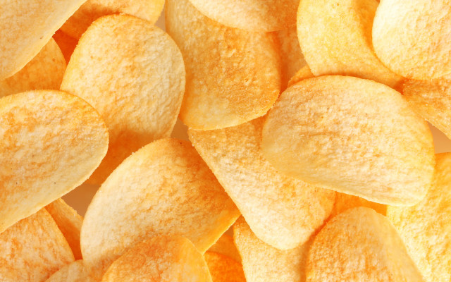 Yellow potato chips white surface free wallpaper for desktop - medium preview image