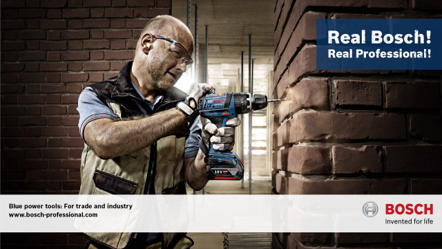 Man holding drill gun brick free wallpaper for desktop - medium preview image