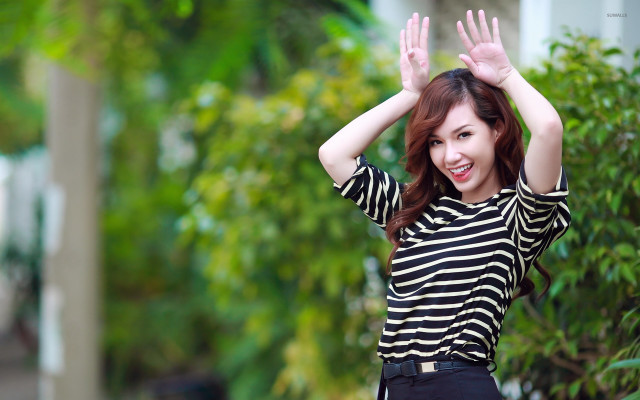 Woman striped shirt waving hands free wallpaper for desktop - medium preview image