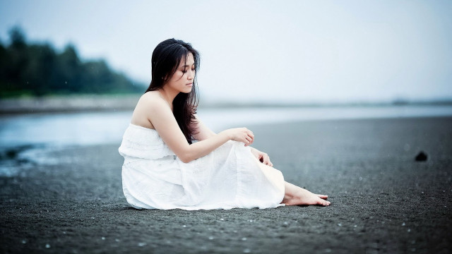 Woman white dress sitting beach free wallpaper for desktop - medium preview image