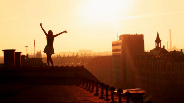 Jumping person roof sunset arms free wallpaper for desktop - medium preview image