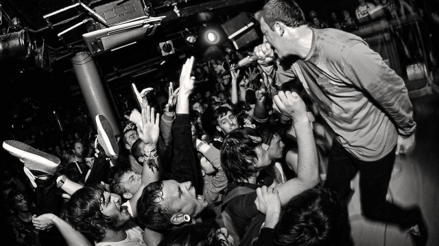 Man stage hands air crowd free wallpaper for desktop - medium preview image