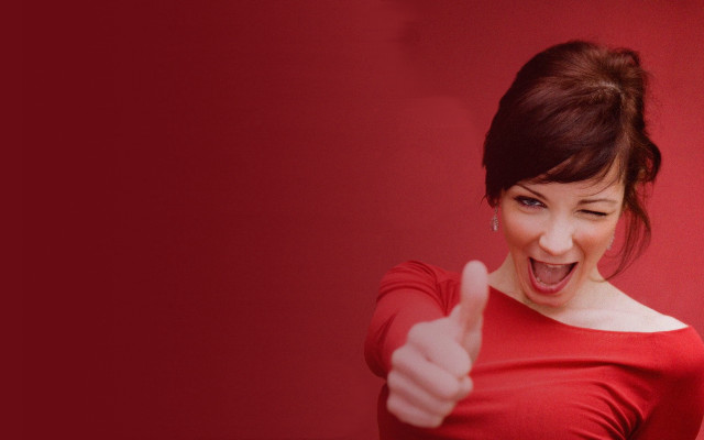 Red shirt woman thumb up free wallpaper for desktop - medium preview image