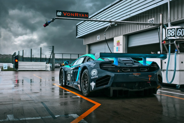 Blue race car rainy day free wallpaper for desktop - medium preview image