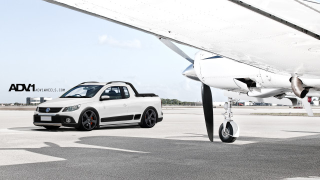 White car parked white airplane free wallpaper for desktop - medium preview image