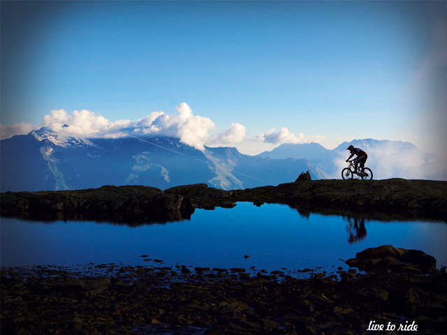Man riding bike mountain lake #2 free wallpaper for desktop - medium preview image